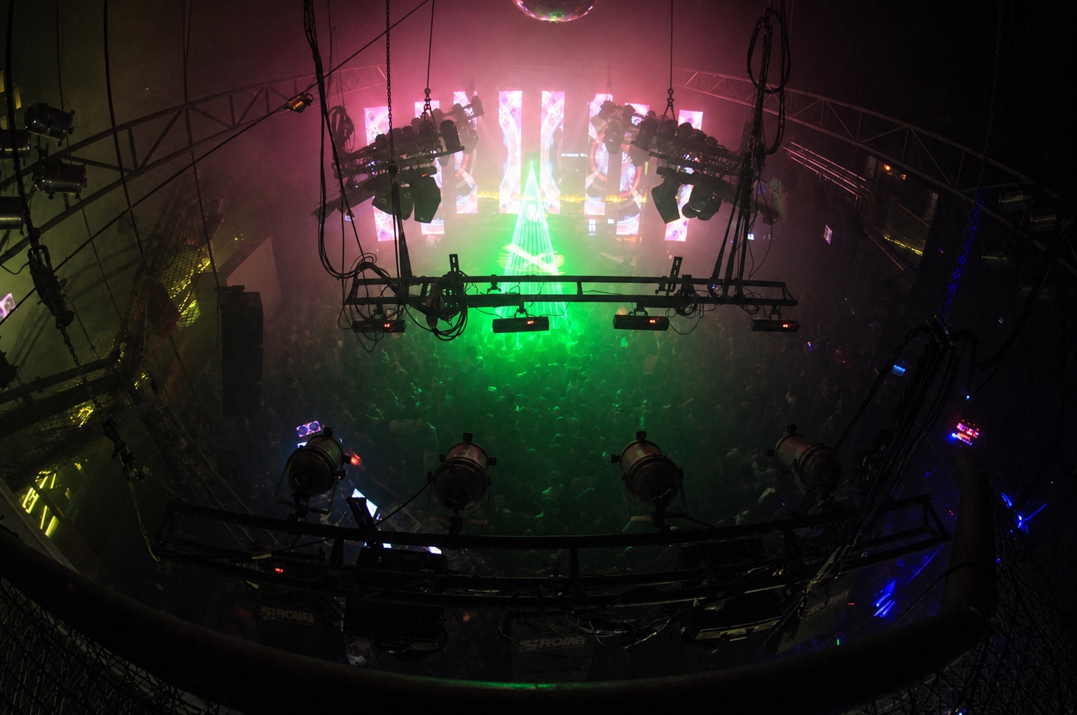 Overhead view of a packed nightclub and lighting rig