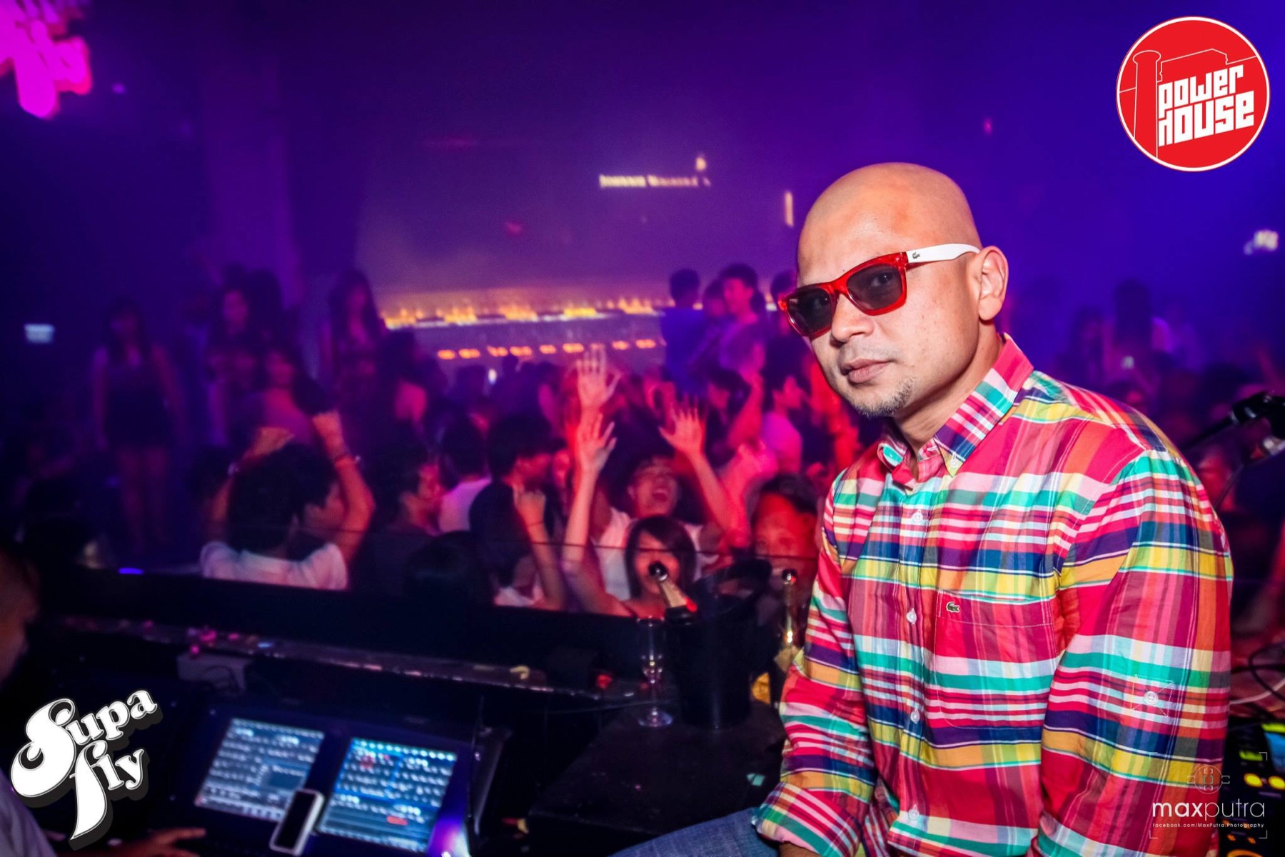 DJ Kzee at Powerhouse with the crowd behind him